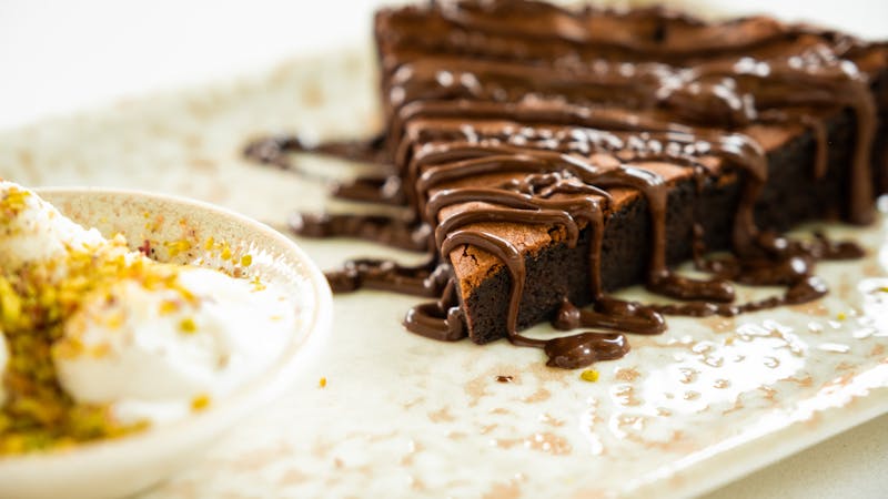Brownie dessert with chocolate drizzle